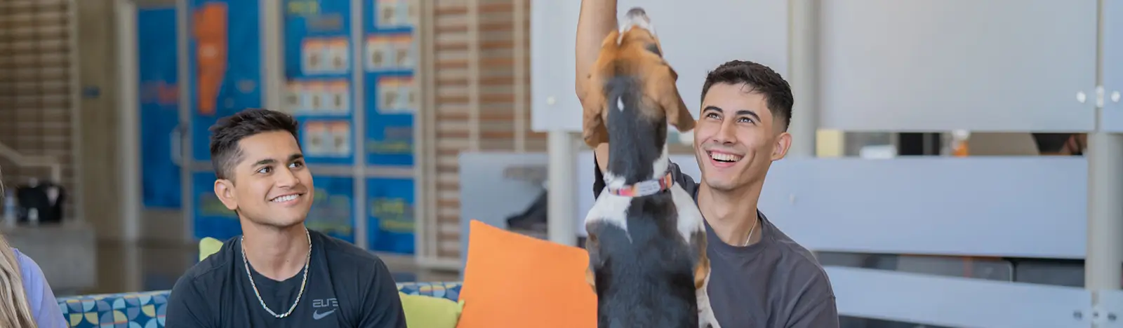 young adults and a dog